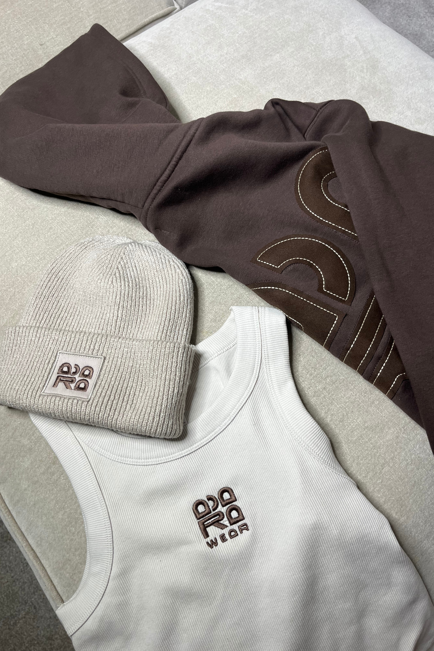 Beige beanie with brown embroidery